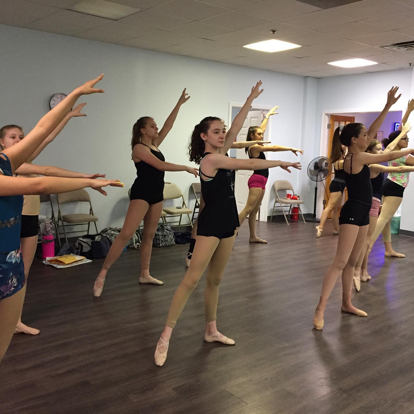 Symmetry Dance Company Company dancers ages 7–18 training together in ballet class