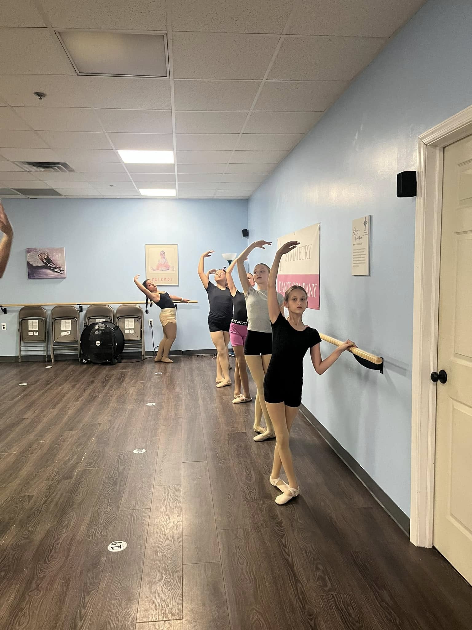 Symmetry Dance Company Pre-Teen dancers ages 9–12 practicing ballet at the barre in Scranton studio