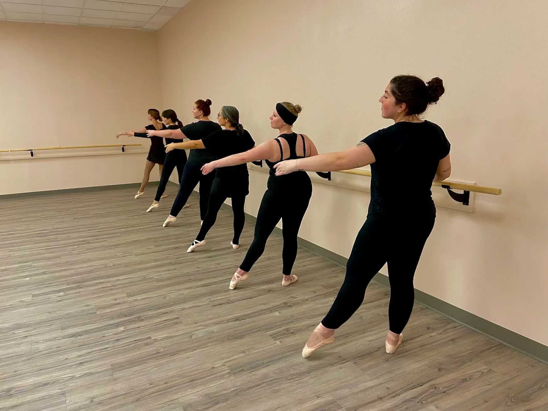Young dancers practicing at ballet bar in toddler ballet class in Scranton, PA